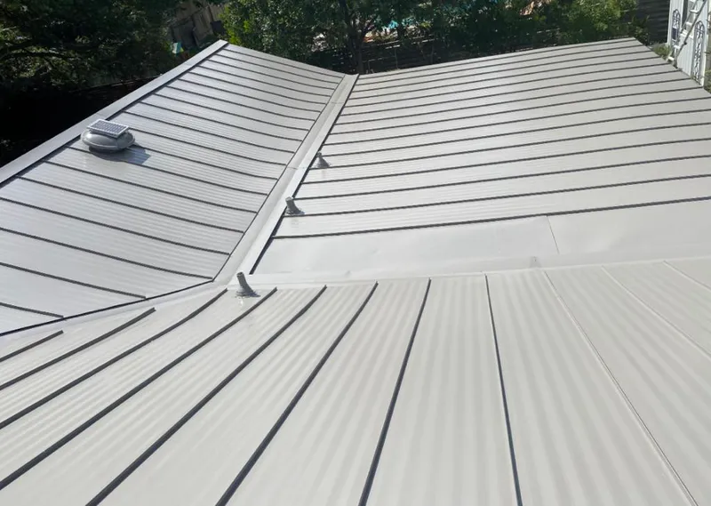 Solar attic fan installed on a metal roof for Roof Ventilation in Lakeville