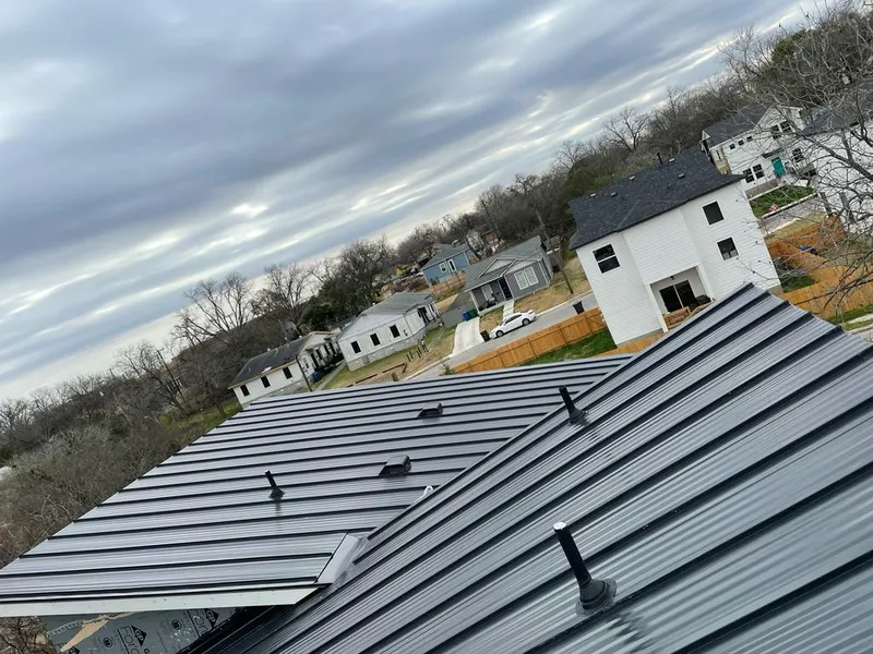 Standing seam metal roof panels with vents for Skylight Repair in Lakeville